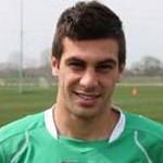 Мбутзикос, Николас